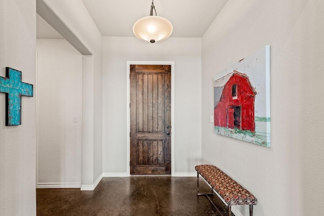 8054 Stone Mountain Trl, San Marcos, TX 78666 - foyer entrance featuring concrete flooring and baseboards
