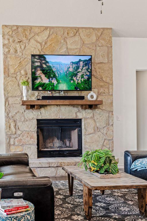 8054 Stone Mountain Trl, San Marcos, TX 78666 - living room featuring a stone fireplace