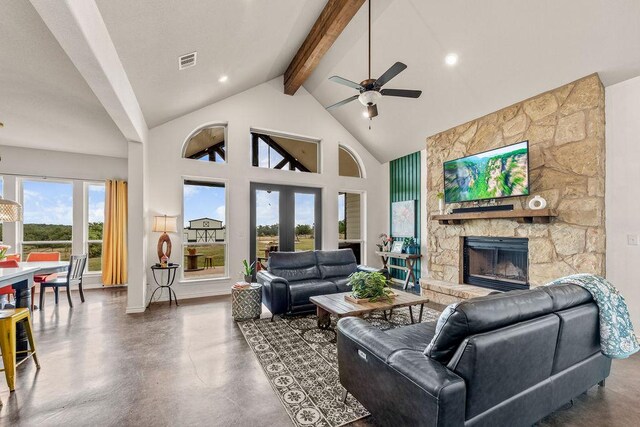 8054 Stone Mountain Trl, San Marcos, TX 78666 - living room with beam ceiling, a fireplace, ceiling fan, high vaulted ceiling, and finished concrete flooring
