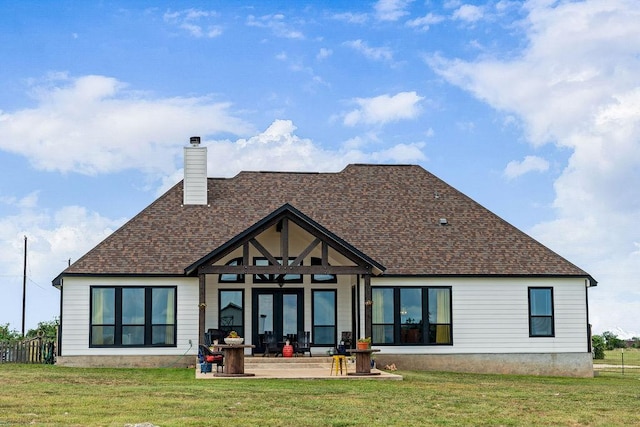 8054 Stone Mountain Trl, San Marcos, TX 78666 - rear view of property with a yard, a chimney, and roof with shingles
