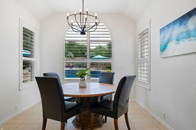 207 Dry Creek Rd, Austin, TX 78737 - dining room featuring a chandelier, light tile patterned flooring, and lofted ceiling