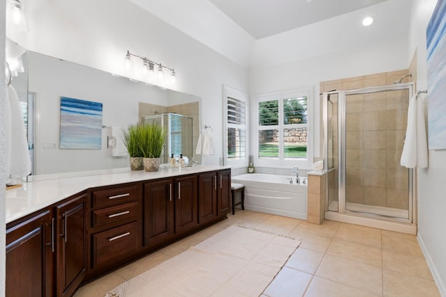 207 Dry Creek Rd, Austin, TX 78737 - bathroom featuring tile patterned flooring, vanity, a shower stall, a garden tub, and recessed lighting