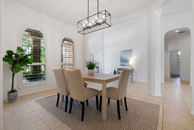 207 Dry Creek Rd, Austin, TX 78737 - dining area featuring light tile patterned floors and arched walkways