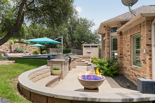 207 Dry Creek Rd, Austin, TX 78737 - fenced backyard with a patio area, a shed, and an outdoor kitchen