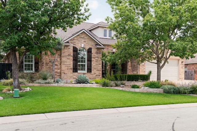 207 Dry Creek Rd, Austin, TX 78737 - view of front of home featuring brick siding, concrete driveway, a garage, and a shingled roof