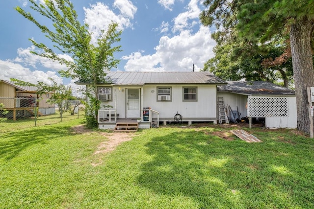 105 San Jacinto St, Smithville, TX 78957 - back of property with a metal roof