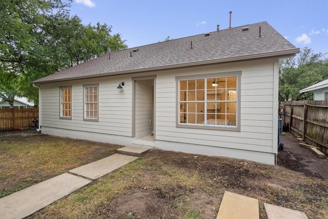 6516 Garden View Dr, Austin, TX 78724 - rear view of house featuring roof with shingles