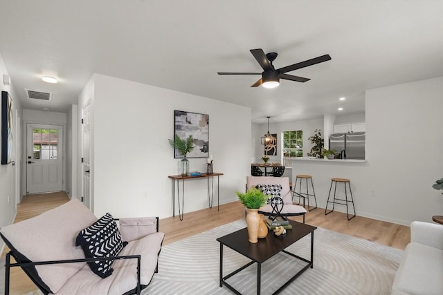 6516 Garden View Dr, Austin, TX 78724 - living room featuring a ceiling fan, light wood-type flooring, and recessed lighting