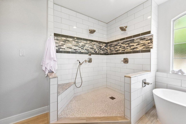 2009 Palos Verdes, Leander, TX 78641 - full bath featuring tiled shower, a freestanding bath, and wood finished floors