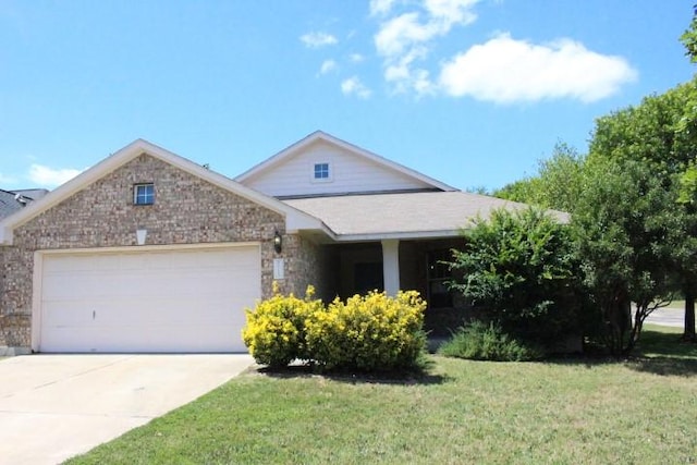 715 Spring Brook Ln, Leander, TX 78641 - view of front facade with a garage, concrete driveway, a front yard, and stone siding