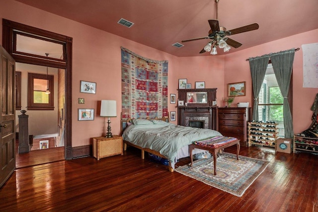 124 N Hamilton St, Gonzales, TX 78629 - bedroom featuring hardwood / wood-style floors and a fireplace