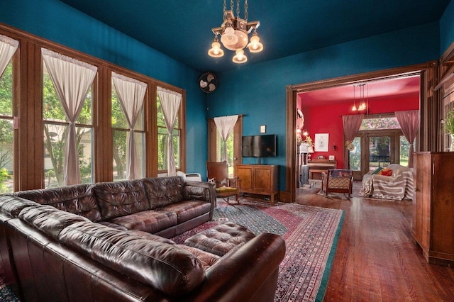 124 N Hamilton St, Gonzales, TX 78629 - living area featuring a chandelier and wood finished floors