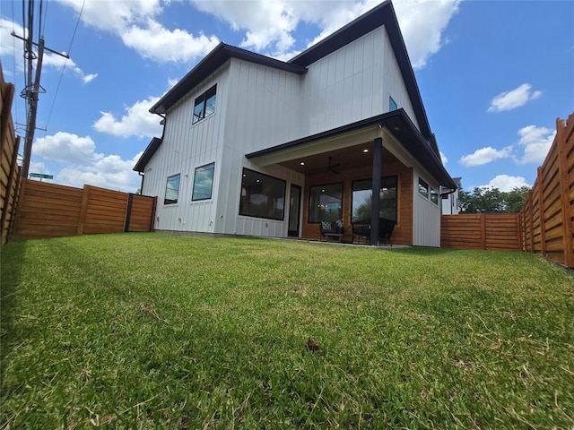 5301 Grover Ave, Austin, TX 78756 - back of property with a fenced backyard and board and batten siding
