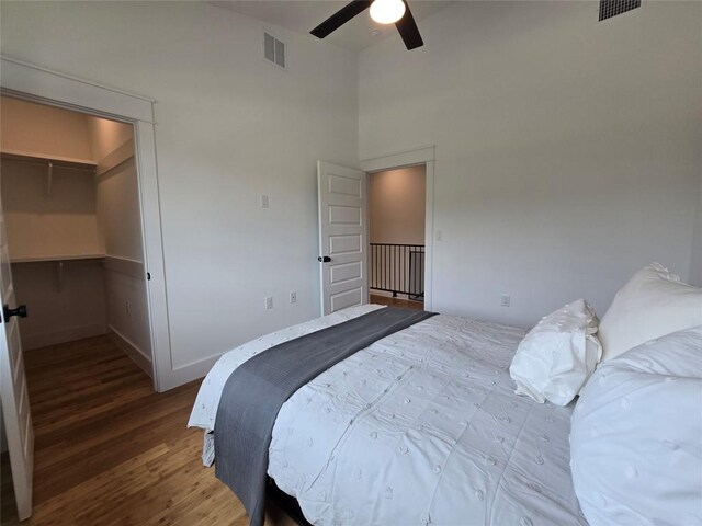 5301 Grover Ave, Austin, TX 78756 - bedroom with wood finished floors, a spacious closet, a ceiling fan, and a towering ceiling