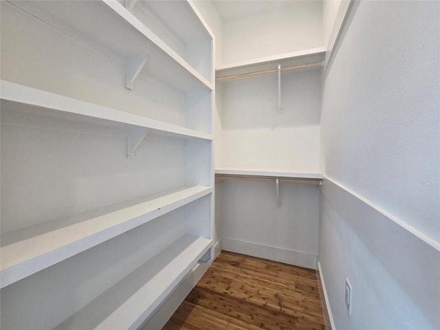 5301 Grover Ave, Austin, TX 78756 - walk in closet with dark wood-style floors