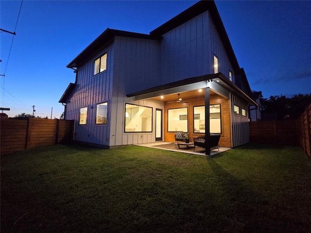 5301 Grover Ave, Austin, TX 78756 - back of property with board and batten siding, a fenced backyard, a patio, and ceiling fan