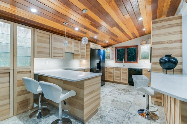 19 Sugar Shack Dr, West Lake Hills, TX 78746 - kitchen with black appliances, wood ceiling, decorative backsplash, vaulted ceiling, and a breakfast bar area