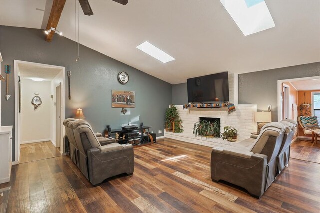 213 Circle C Ave, Fort Davis, TX 79734 - living room featuring a skylight, wood finished floors, a fireplace, and a ceiling fan