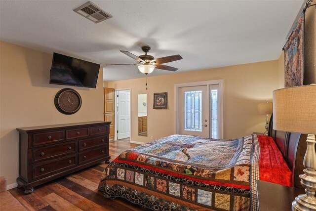 213 Circle C Ave, Fort Davis, TX 79734 - bedroom with dark wood finished floors, ceiling fan, and access to outside