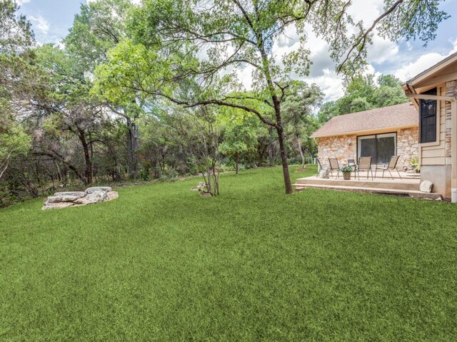 4506 Twisted Tree Cv, Austin, TX 78735 - view of green lawn with a patio
