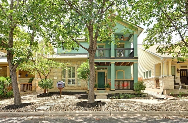 4024 Camacho St, Austin, TX 78723 - view of front of home with a balcony, a porch, stone siding, and stucco siding