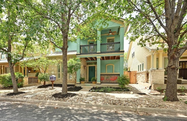 4024 Camacho St, Austin, TX 78723 - view of front of house with a balcony, a ceiling fan, a porch, and stucco siding