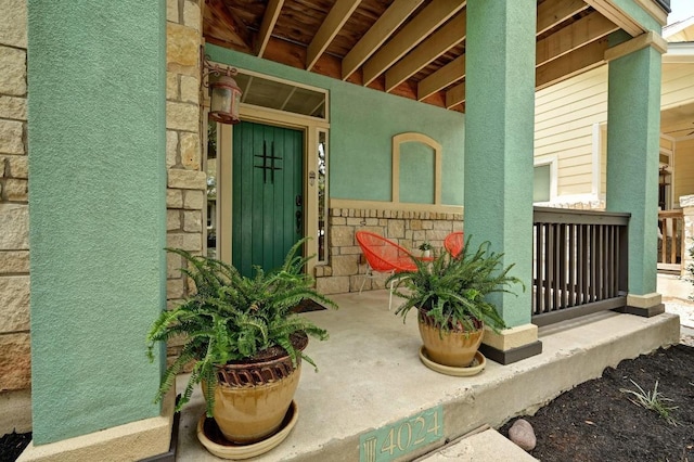 4024 Camacho St, Austin, TX 78723 - doorway to property featuring a porch and stone siding