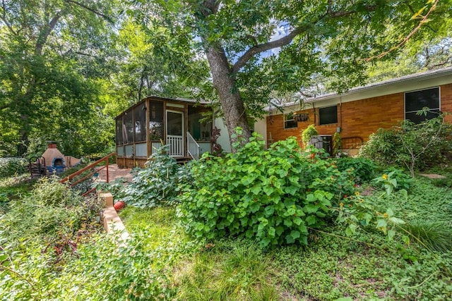 107 W Caddo St, Austin, TX 78753 - view of yard with a sunroom