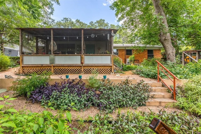 107 W Caddo St, Austin, TX 78753 - back of property featuring a sunroom and stairway