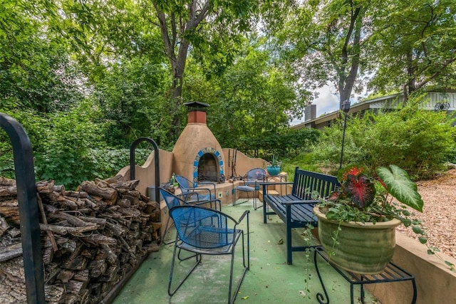 107 W Caddo St, Austin, TX 78753 - view of patio featuring an outdoor living space with a fireplace