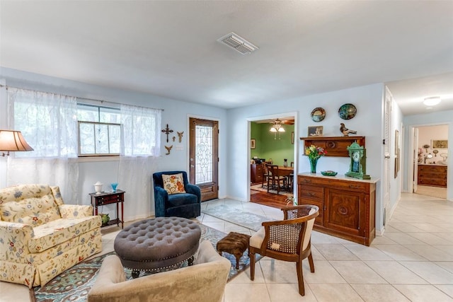107 W Caddo St, Austin, TX 78753 - sitting room with light tile patterned floors and baseboards
