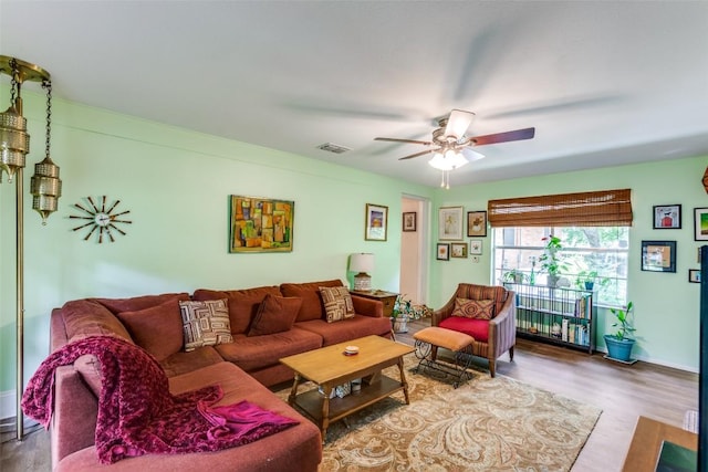 107 W Caddo St, Austin, TX 78753 - living room with ceiling fan and wood finished floors