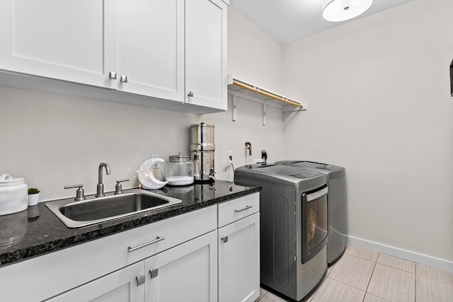 179 Sandy Creek Cv, Driftwood, TX 78619 - laundry room featuring cabinet space, separate washer and dryer, and light tile patterned flooring