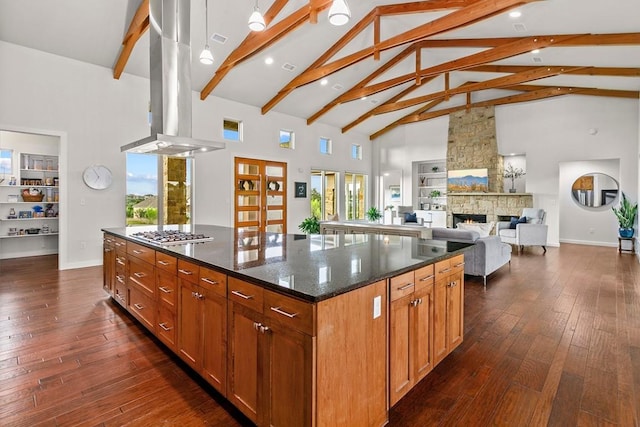 179 Sandy Creek Cv, Driftwood, TX 78619 - kitchen with island exhaust hood, high vaulted ceiling, a fireplace, a kitchen island, and beamed ceiling