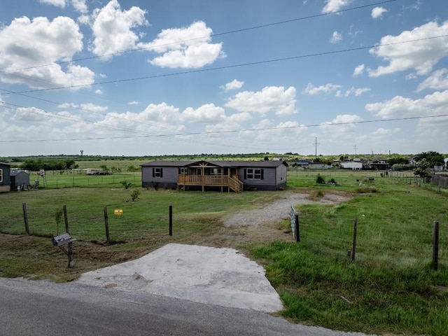754 Altwein Ln, New Braunfels, TX 78130 - view of front of house featuring a deck, a view of countryside, and dirt driveway