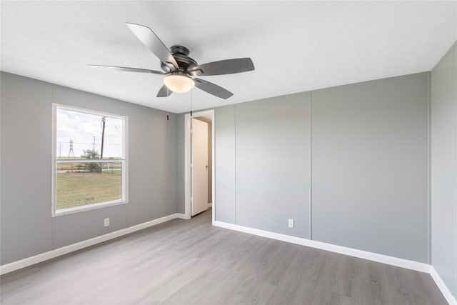 754 Altwein Ln, New Braunfels, TX 78130 - spare room featuring wood finished floors and ceiling fan