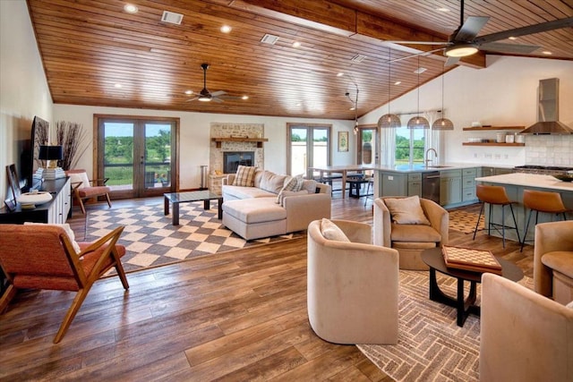 19811 W Ranch Road 152nd Rd, Llano, TX 78643 - living room with ceiling fan, wood ceiling, healthy amount of natural light, wood finished floors, and a fireplace