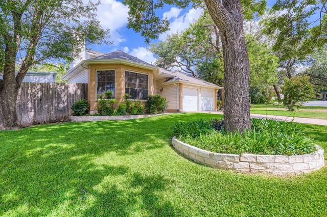 4513 Sidereal Dr, Austin, TX 78727 - ranch-style house with a garage, a chimney, and driveway
