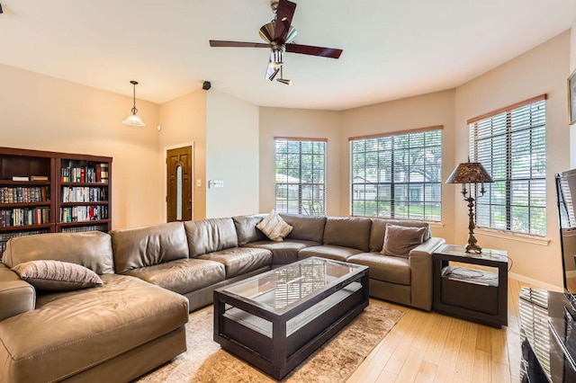 4513 Sidereal Dr, Austin, TX 78727 - living area featuring light wood finished floors and a ceiling fan