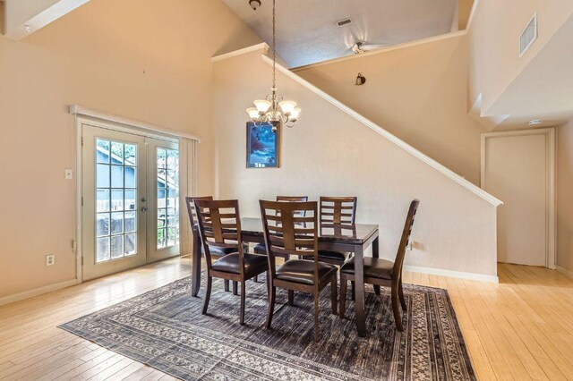 4513 Sidereal Dr, Austin, TX 78727 - dining room with hardwood / wood-style flooring, high vaulted ceiling, french doors, and a chandelier
