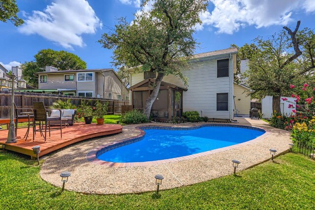 4513 Sidereal Dr, Austin, TX 78727 - view of pool with a wooden deck and a fenced backyard