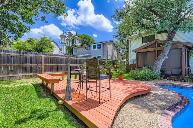 4513 Sidereal Dr, Austin, TX 78727 - wooden deck featuring a fenced backyard and a sunroom