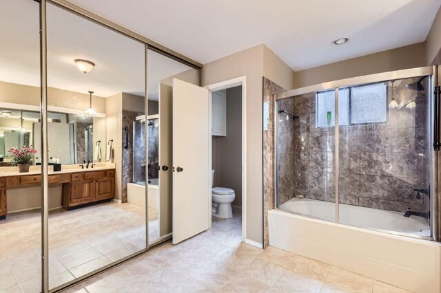 4513 Sidereal Dr, Austin, TX 78727 - full bathroom featuring vanity, bath / shower combo with glass door, and tile patterned flooring