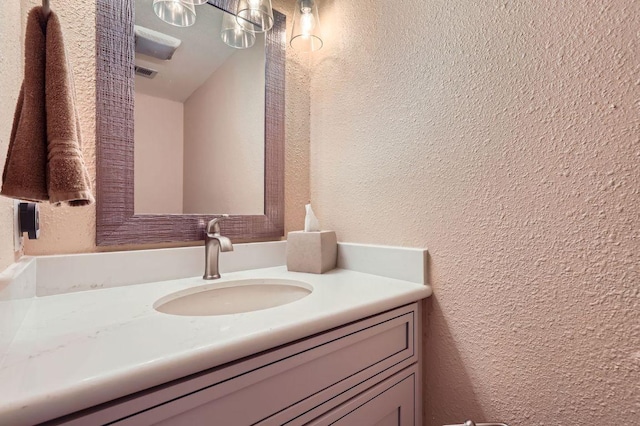 4513 Sidereal Dr, Austin, TX 78727 - bathroom with vanity and a textured wall