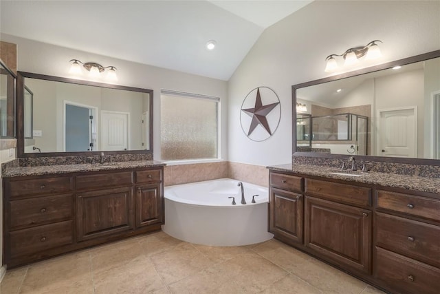 3204 Herrero Path, Cedar Park, TX 78641 - full bath featuring vaulted ceiling, a shower stall, two vanities, a garden tub, and tile patterned flooring