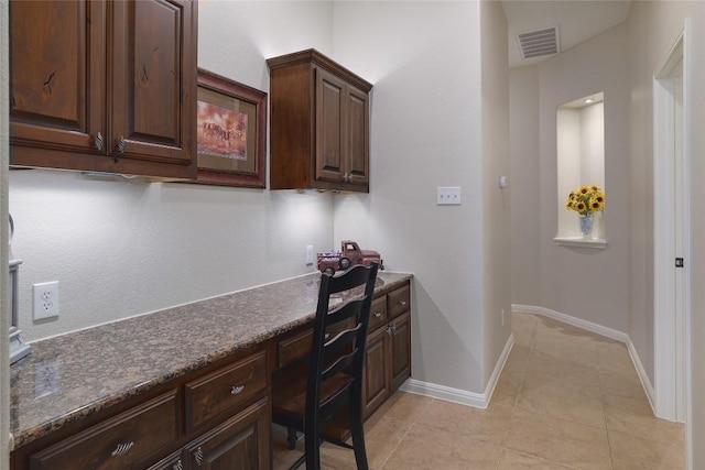 3204 Herrero Path, Cedar Park, TX 78641 - home office featuring built in desk and light tile patterned floors