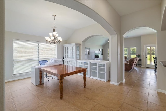 3204 Herrero Path, Cedar Park, TX 78641 - dining area with lofted ceiling, a chandelier, light tile patterned flooring, arched walkways, and ceiling fan