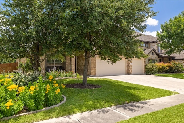 3204 Herrero Path, Cedar Park, TX 78641 - view of front of house featuring stone siding, a garage, and driveway