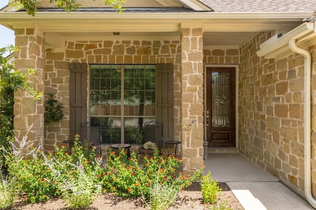 3204 Herrero Path, Cedar Park, TX 78641 - view of exterior entry featuring a shingled roof, covered porch, and stone siding