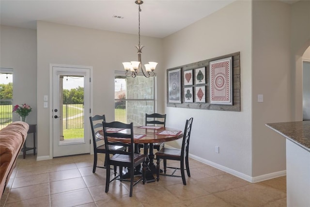 3204 Herrero Path, Cedar Park, TX 78641 - dining area featuring a chandelier, arched walkways, and light tile patterned flooring